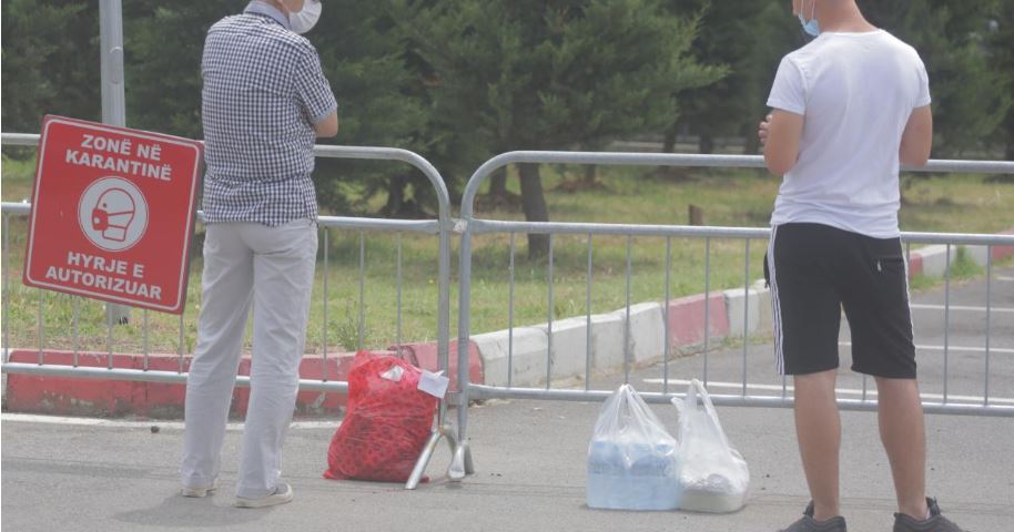 Relatives of the infected in Albania, outside the hospital doors with bags of clothes and food