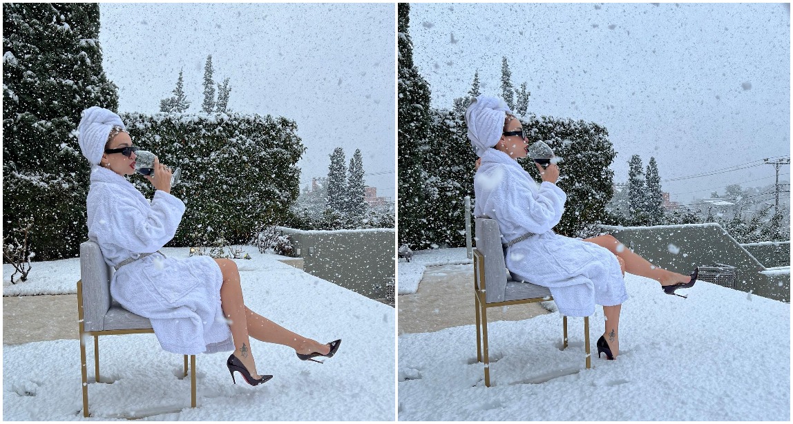 Me rroba banjo dhe taka, këngëtarja shqiptare shijon një gotë verë në dëborë